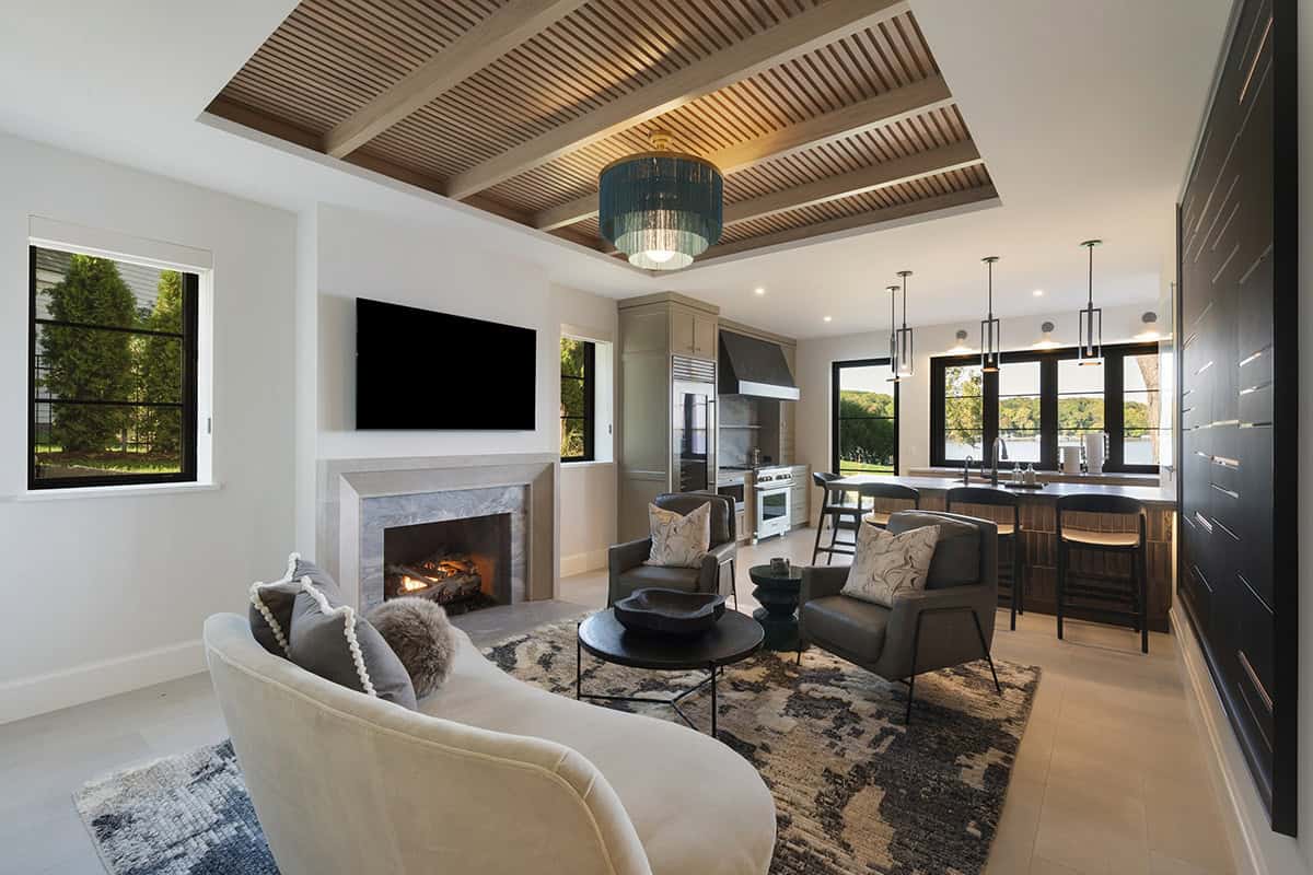 transitional style family room with a fireplace