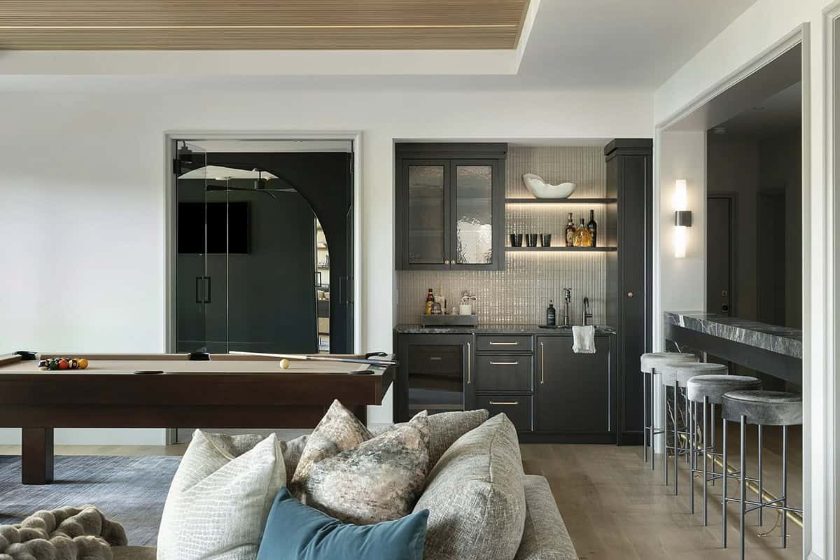 transitional style family room with a pool table 