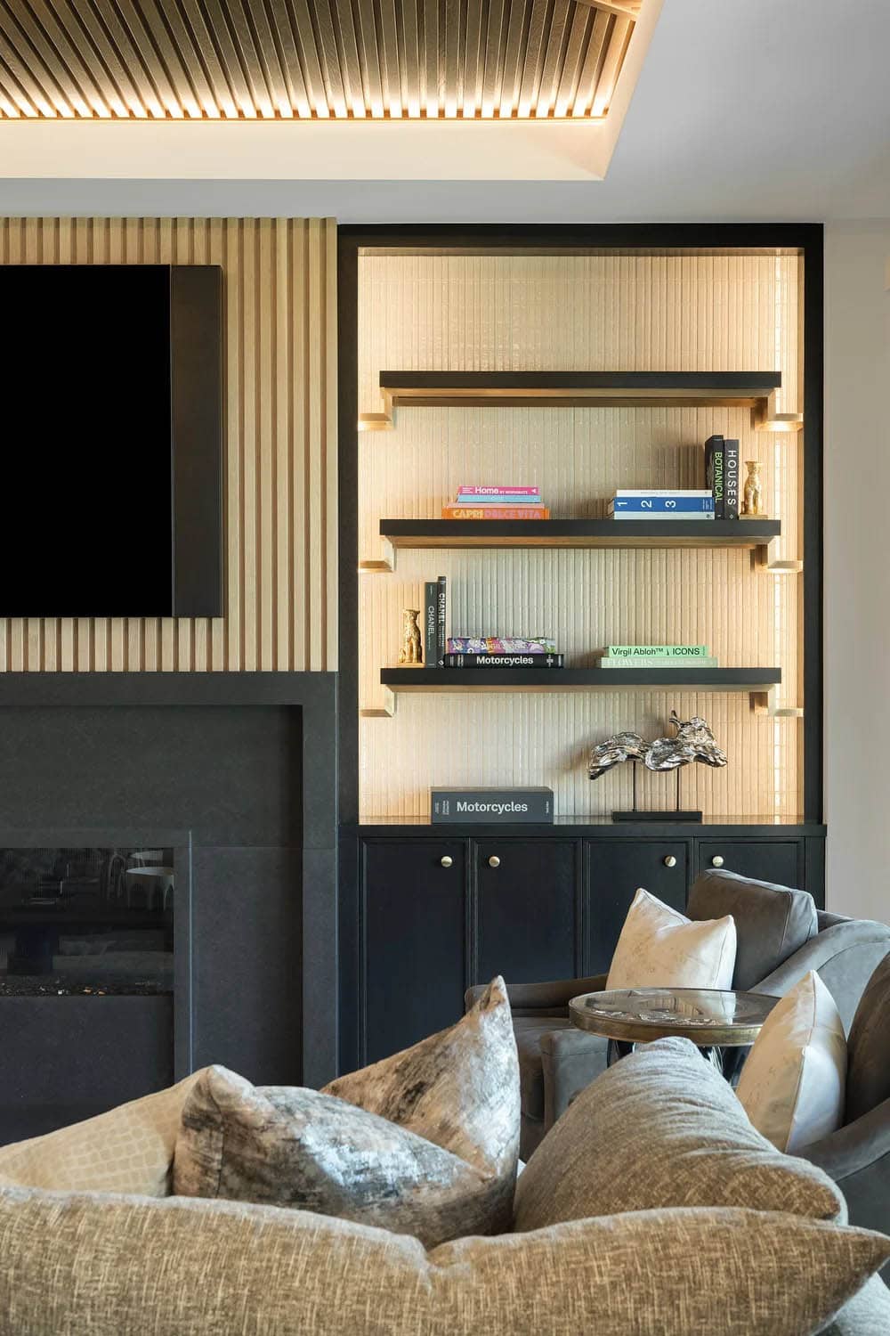 transitional style family room with a fireplace