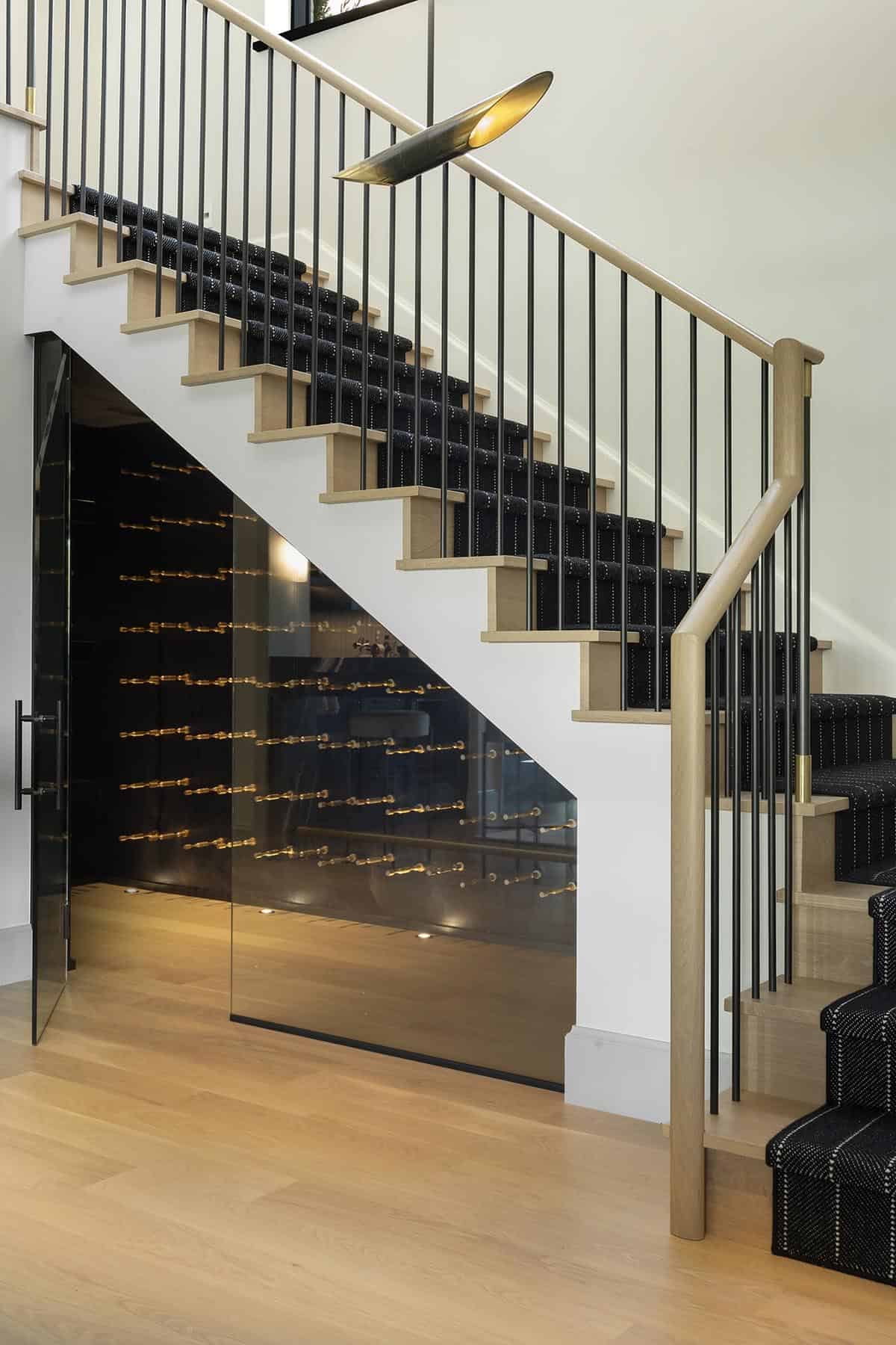 transitional style staircase with a wine cellar