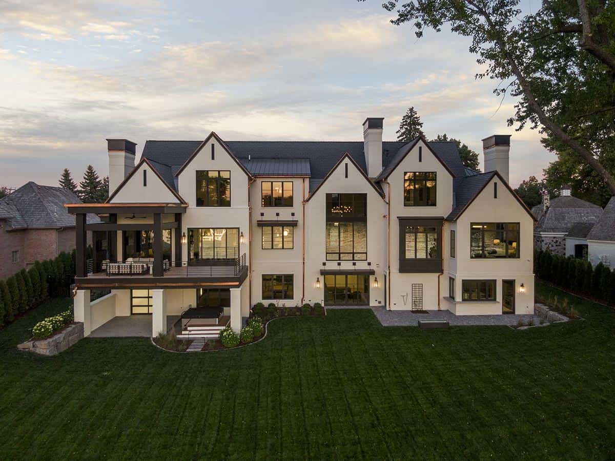 transitional style lake house exterior at dusk