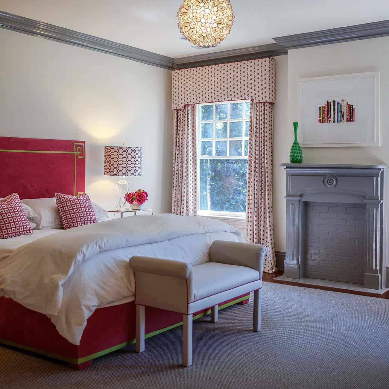 traditonal style bedroom with a faux fireplace