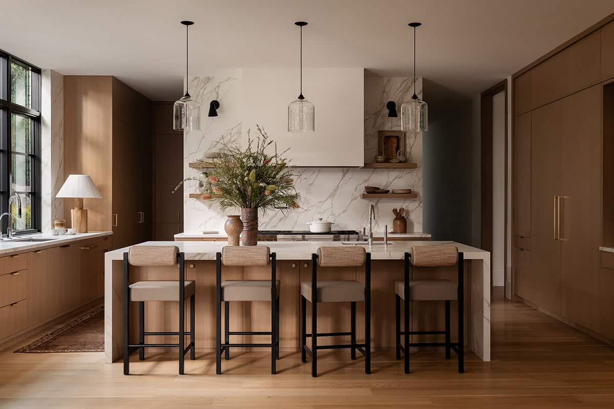 contemporary kitchen with large island and pendant lights