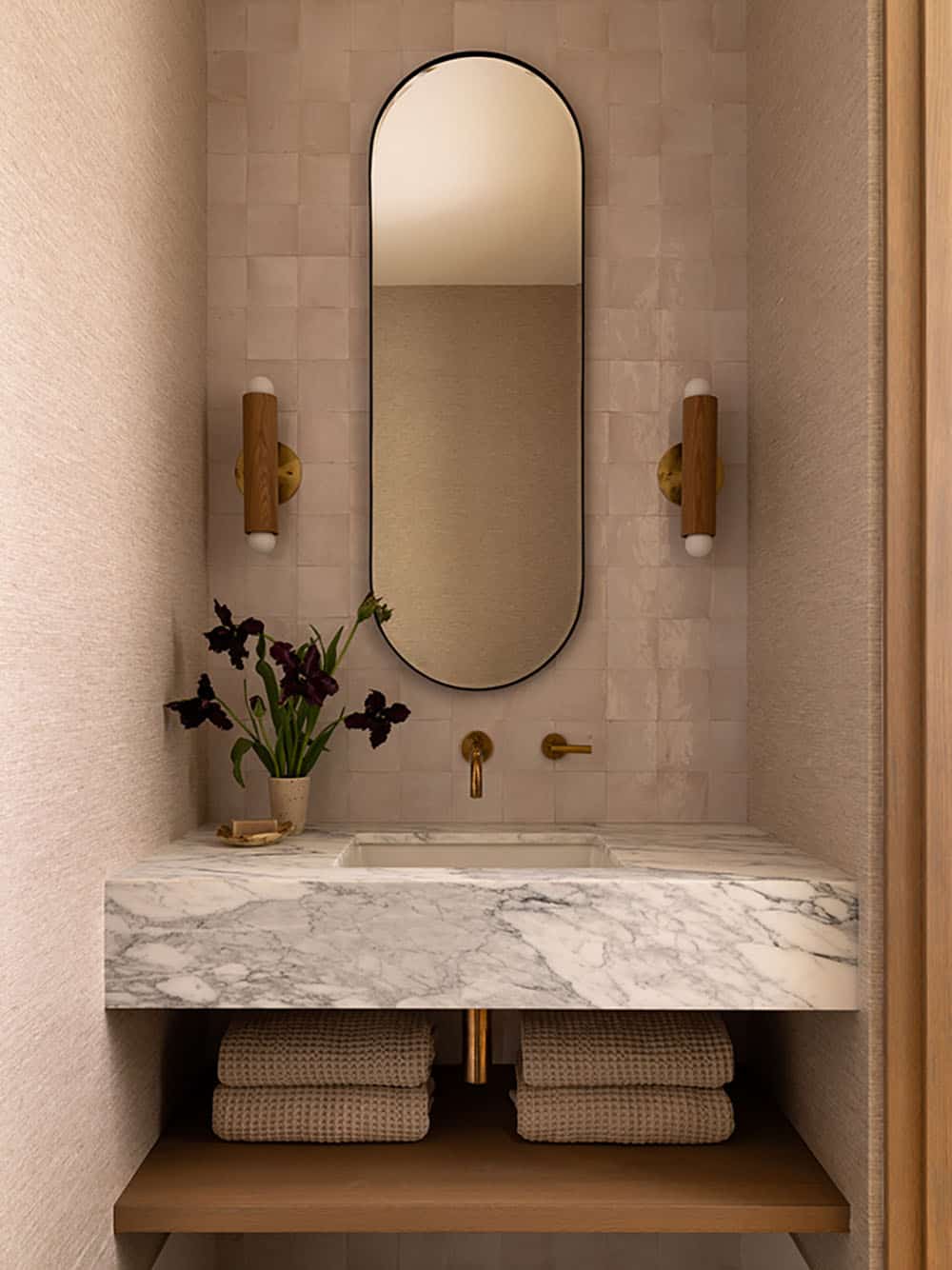 contemporary powder room with a stone vanity