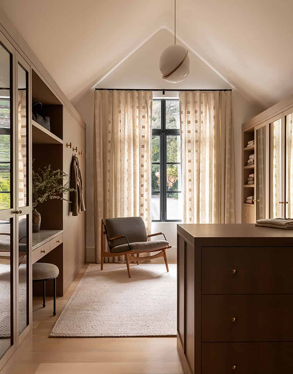 contemporary walk-in closet with a window