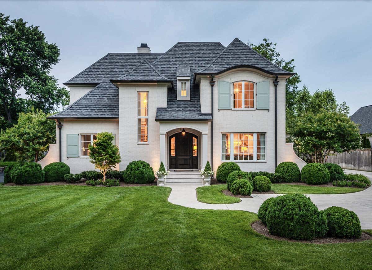 French Country home exterior front view with blue shutters in Belle Meade, Nashville, Tennessee