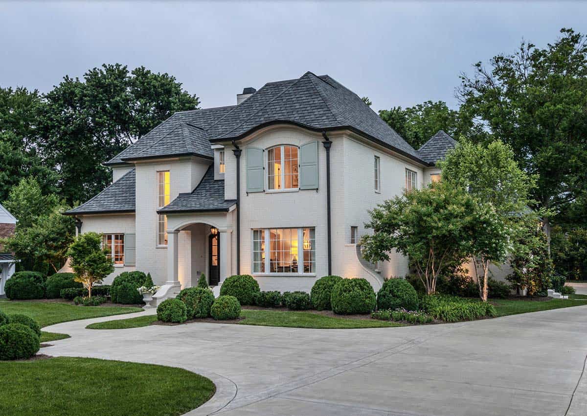 French Country home exterior front view with long tree-lined driveway in Belle Meade, Nashville, Tennessee