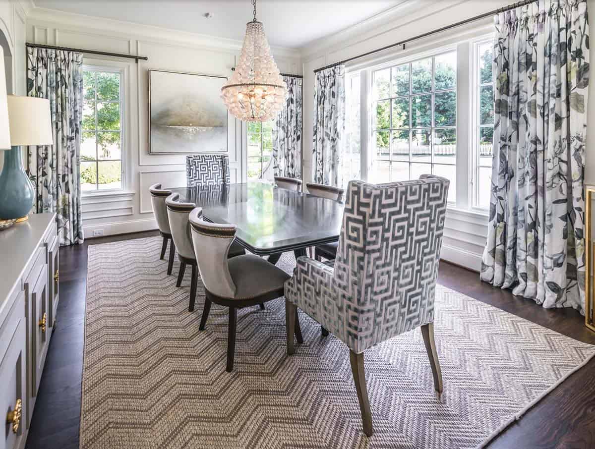 Traditional French Country formal dining room with large chandelier, window treatments, and wainscoting, Nashville Tennessee