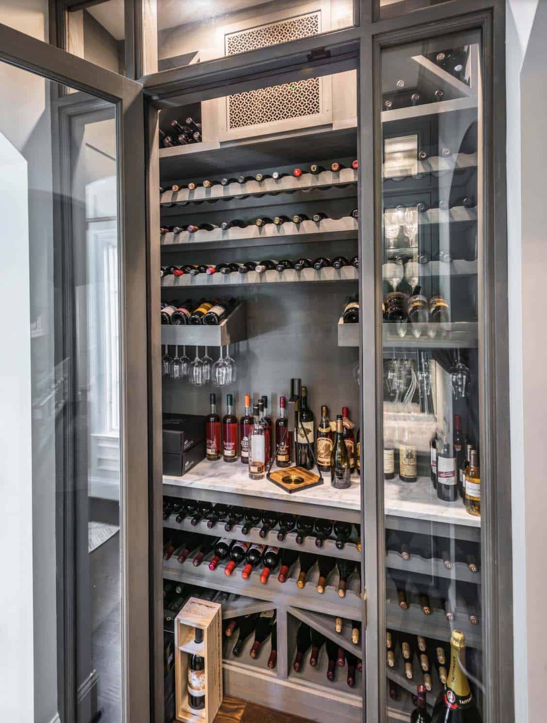 Traditional French Country wine cellar with custom wood storage and stone flooring, Belle Meade Nashville
