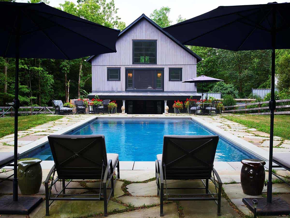 barn exterior with a pool