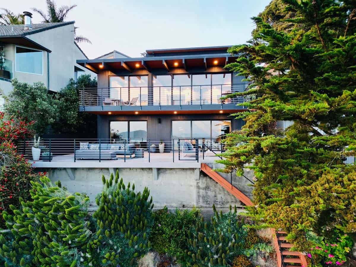 restored midcentury modern hillside home exterior with two story deck overlooking San Francisco Bay Point Richmond California Klopf Architecture