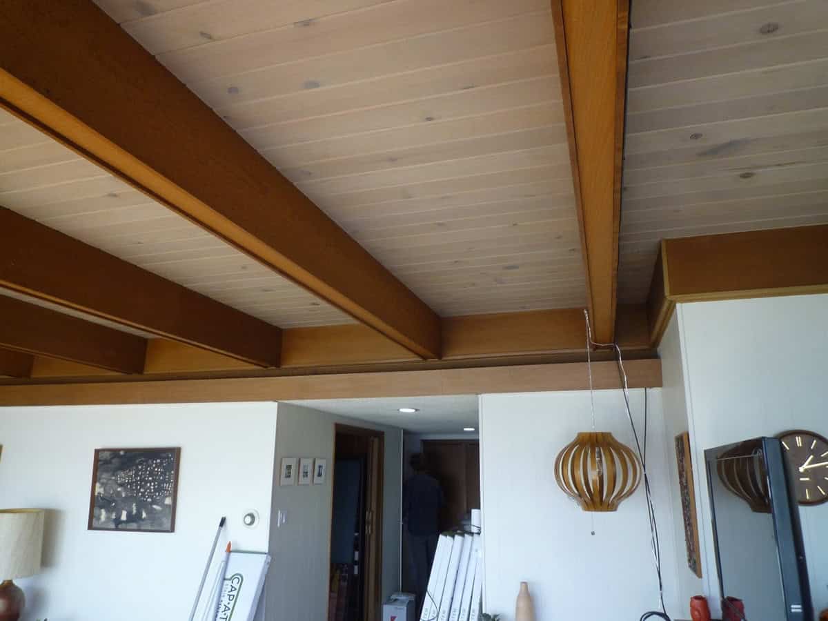 before renovation original wood beam ceiling and open living area midcentury modern home Point Richmond California