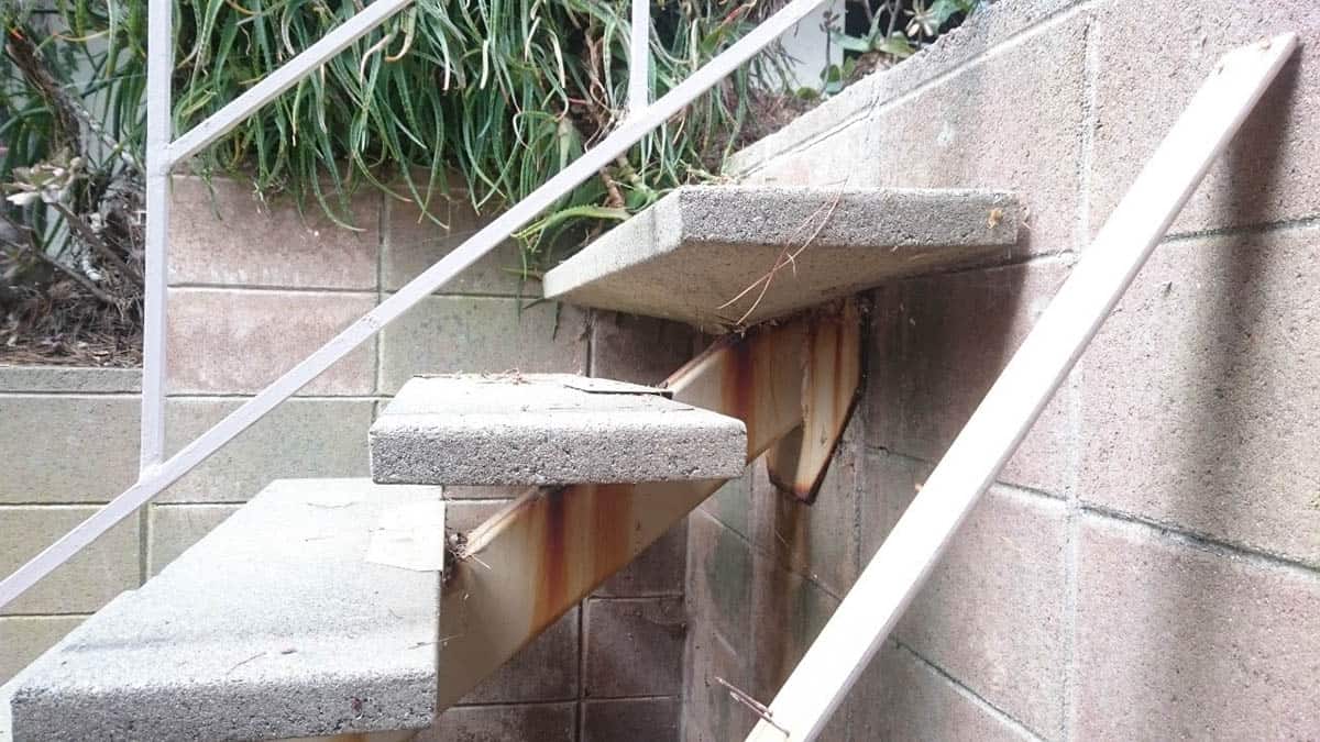 before renovation of midcentury modern outdoor patio staircase detail