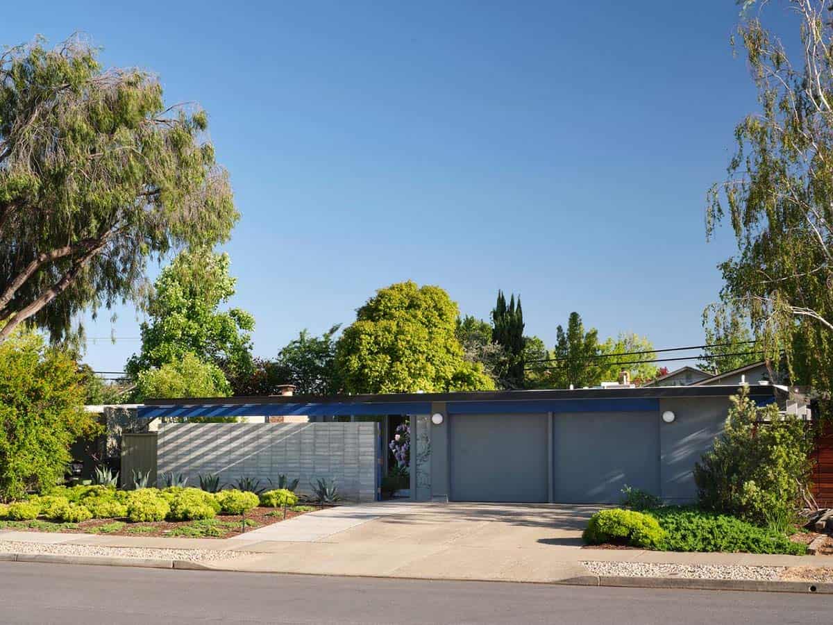 mid-century modern Eichler home street view with flat roof blue steel pergola concrete block wall and low water landscaping Sunnyvale California