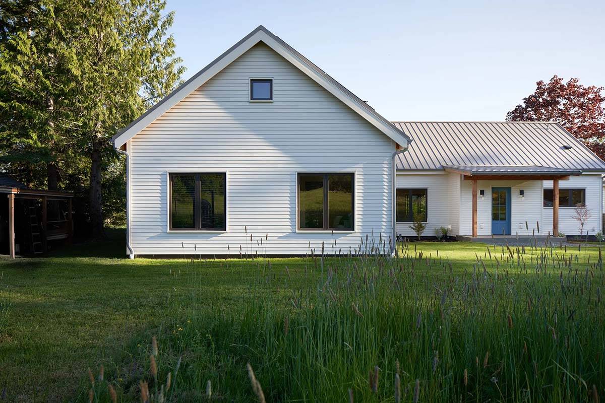 Southeast elevation of the NorthShore Residence showing clean modern farmhouse lines and warm exterior cladding, Bellingham, Washington