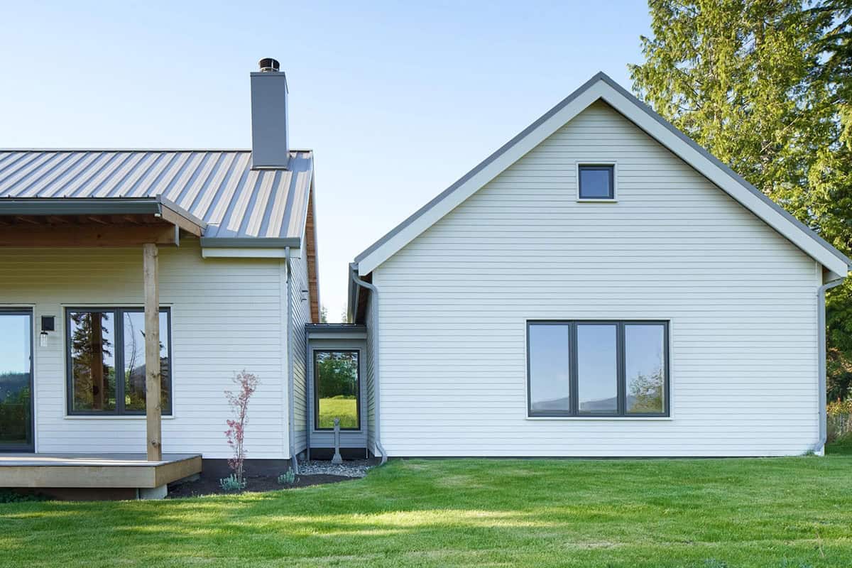 West-facing exterior hallway of the NorthShore Residence showing the architectural bridge that connects the home's wings
