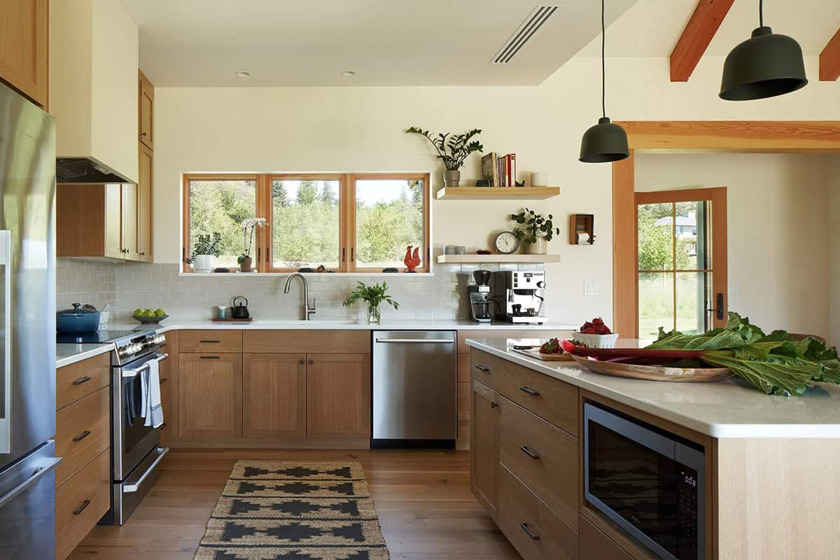 Wide view of the NorthShore Residence kitchen showcasing layout, fixtures, and warm modern farmhouse finishes