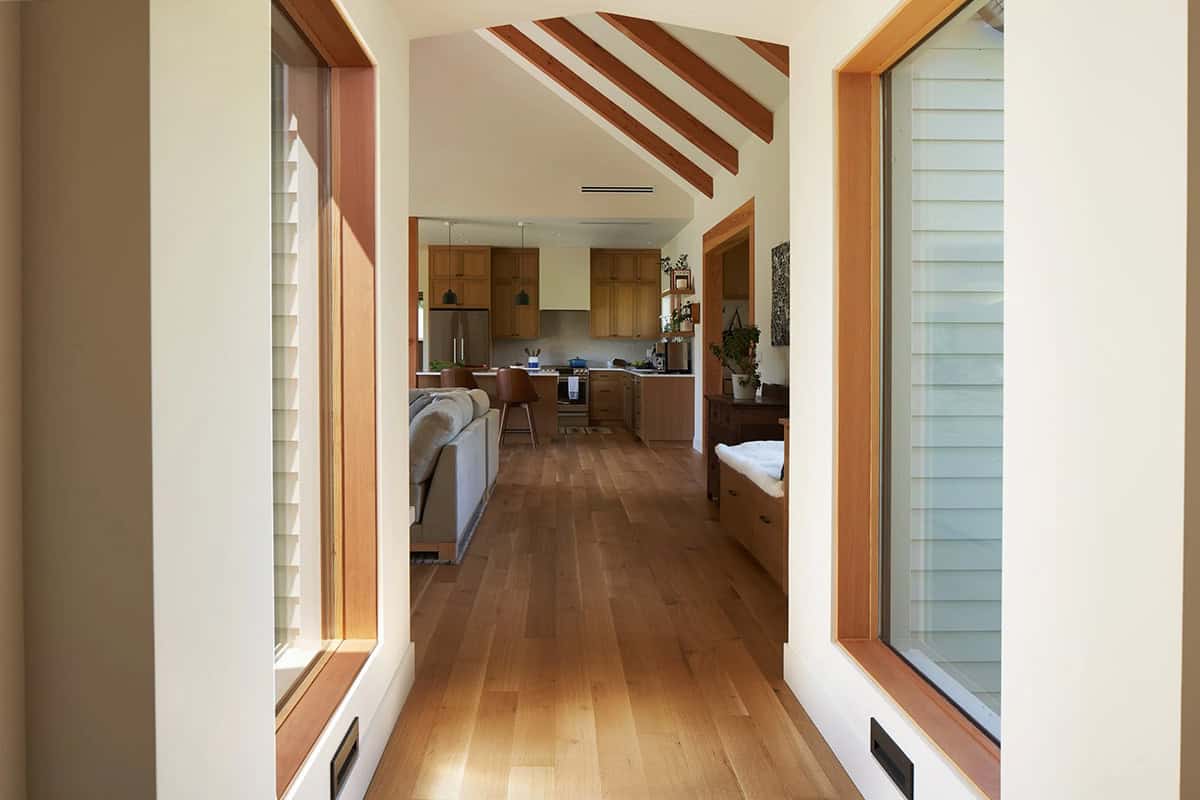NorthShore Residence kitchen as seen from the hallway, highlighting the openness of the central living area