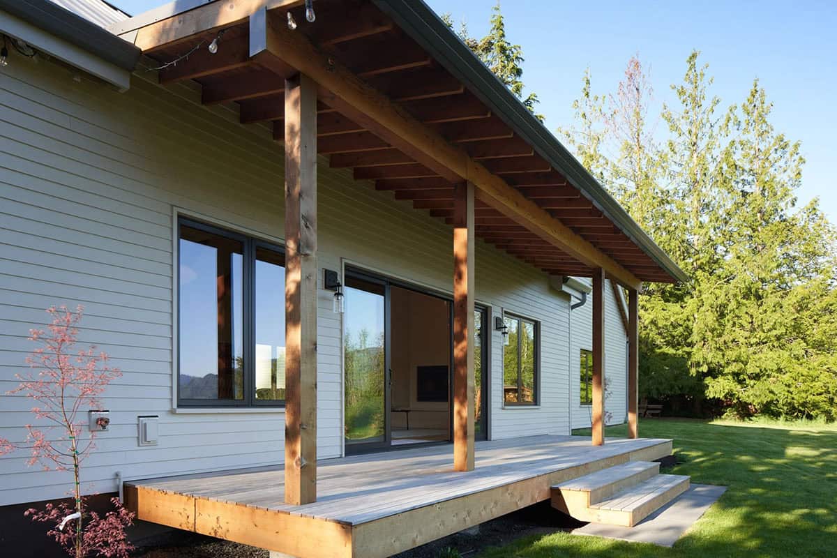Northwest deck of the NorthShore Residence overlooking the meadow and forest on the 3.72-acre watershed property