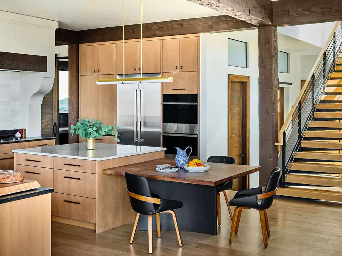 modern kitchen with custom cabinetry and walnut island in alpine retreat
