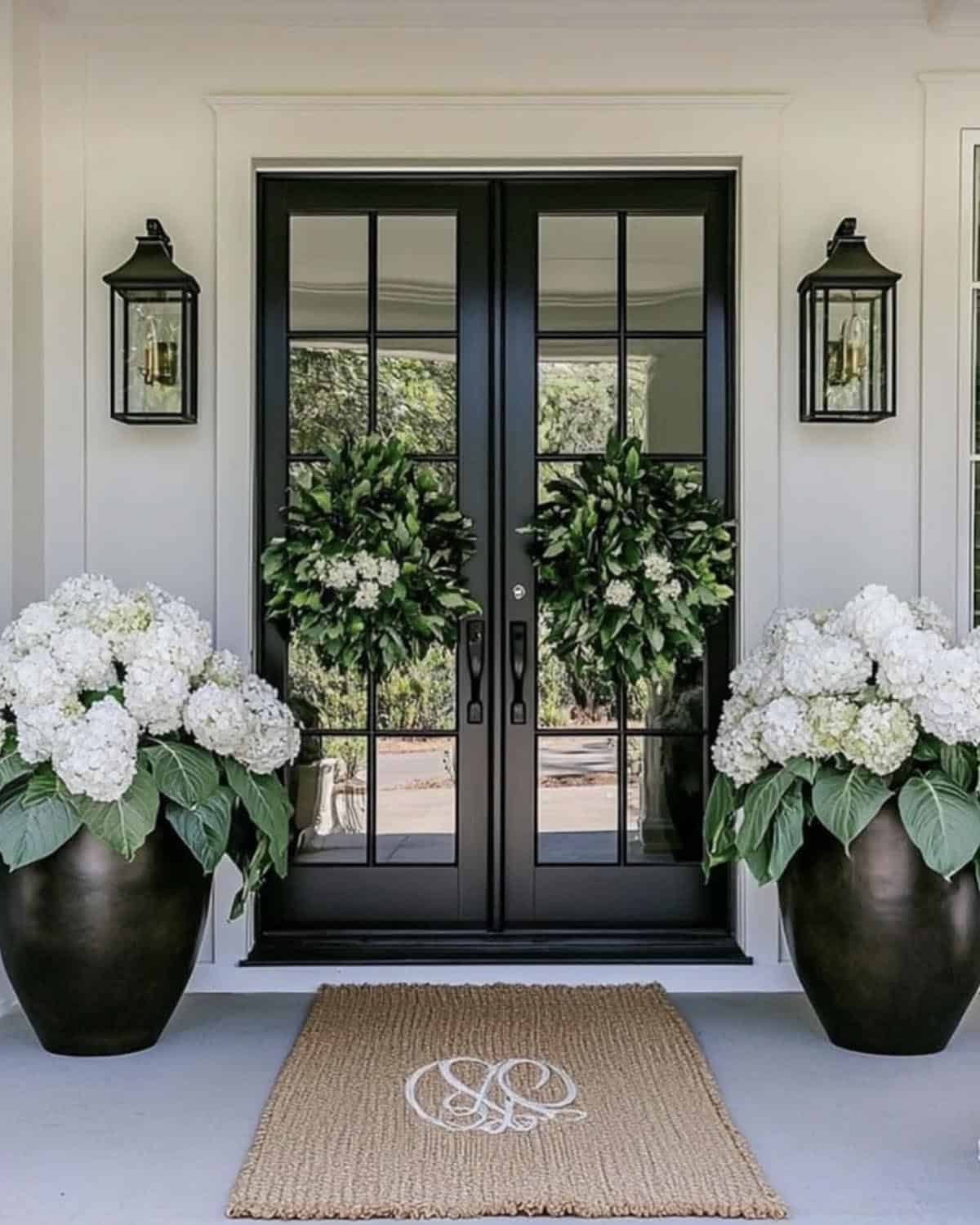 spring front porch with potted hydrangeas and a green wreath