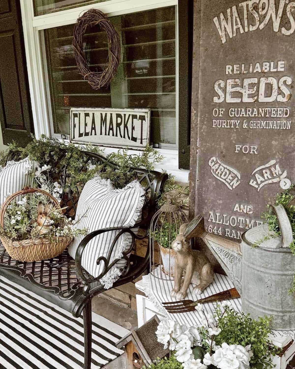 cozy sitting area on the front porch decorated for spring
