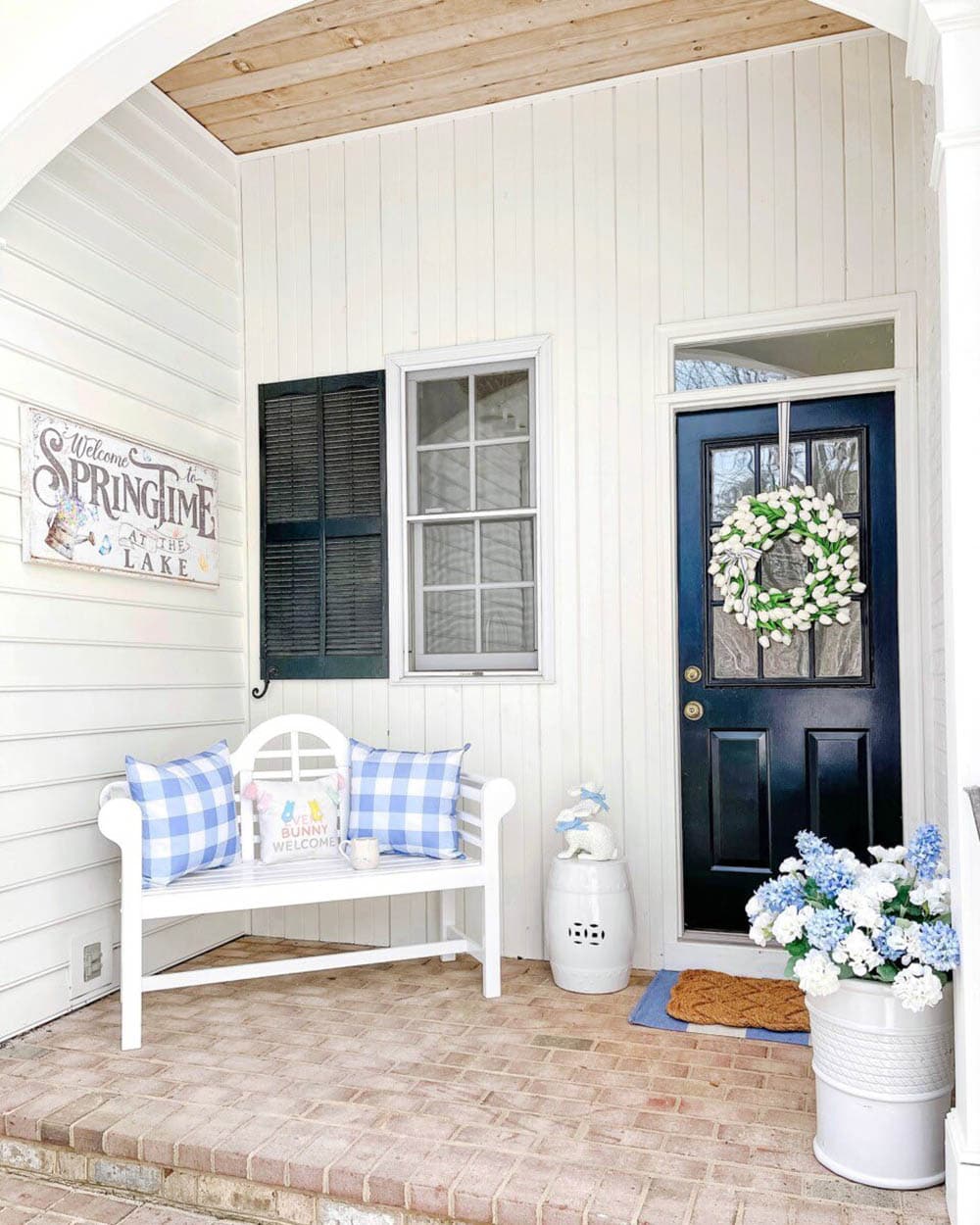 front porch decor with a bench and pillows
