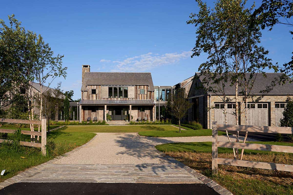 rustic modern barn house exterior with a long driveway