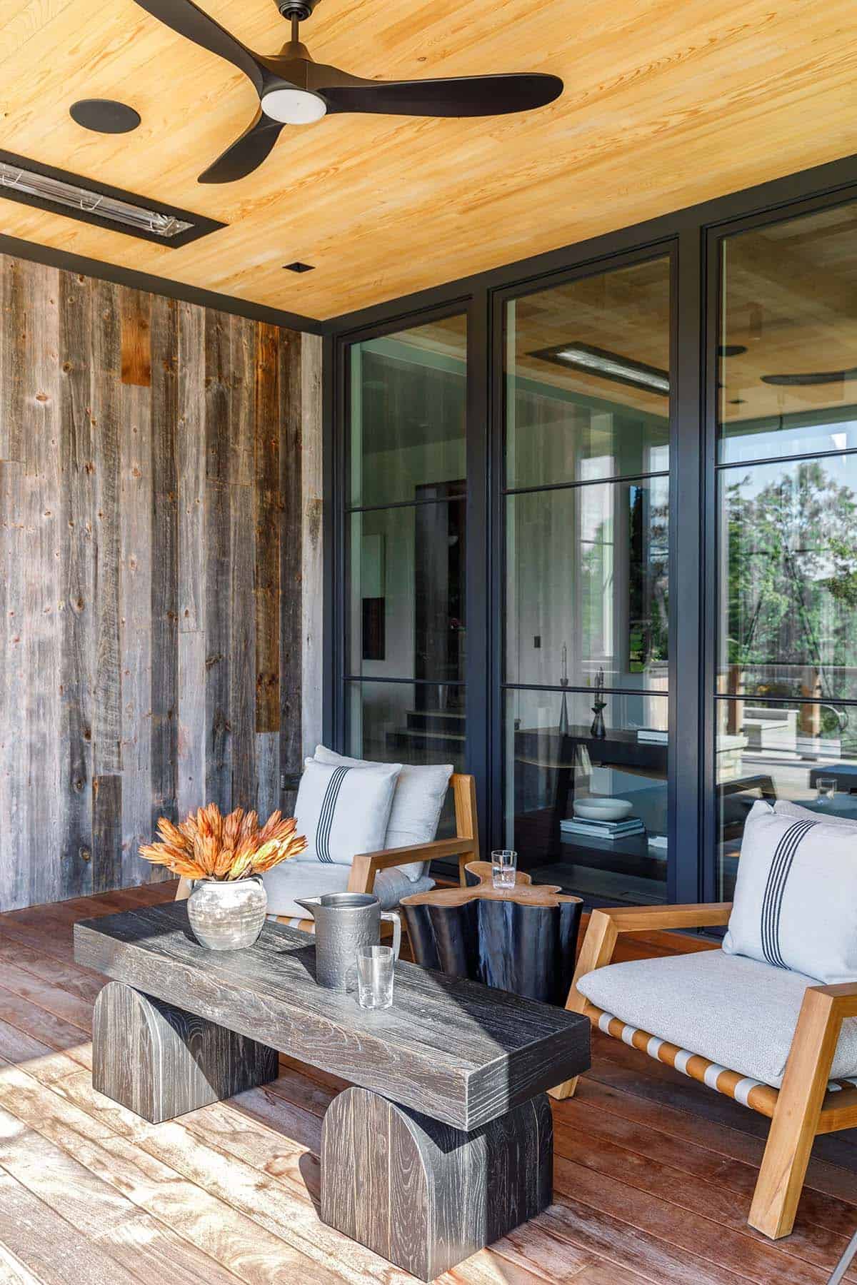 rustic modern barn house exterior covered porch with outdoor furniture
