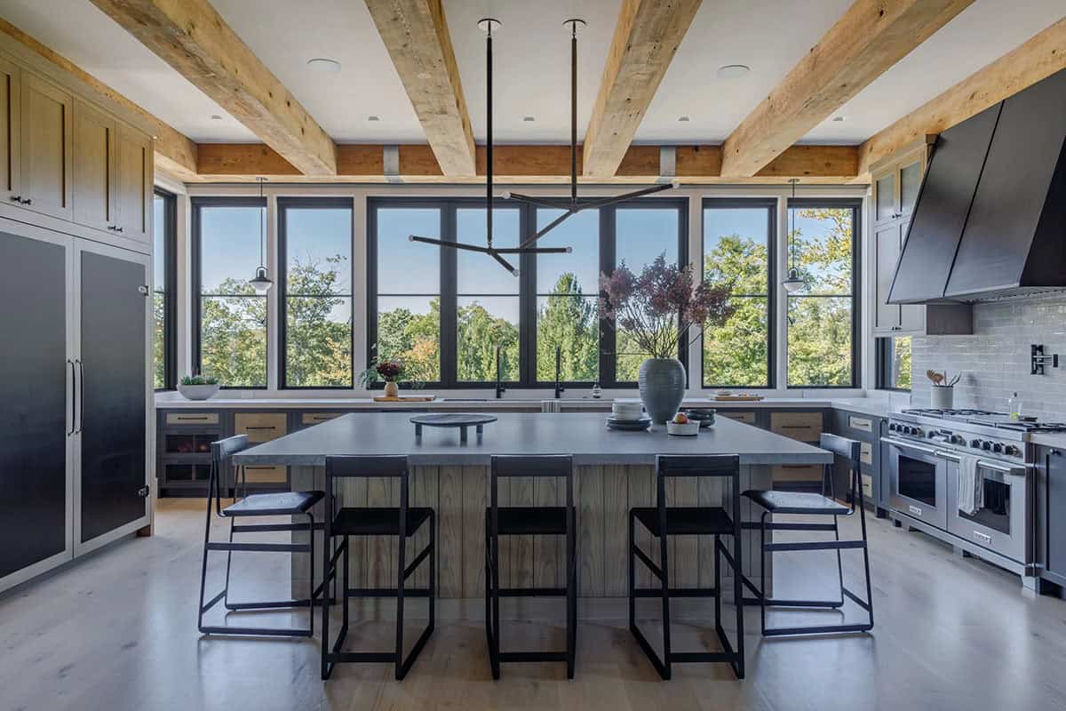 rustic modern kitchen with large windows and wood ceiling beams