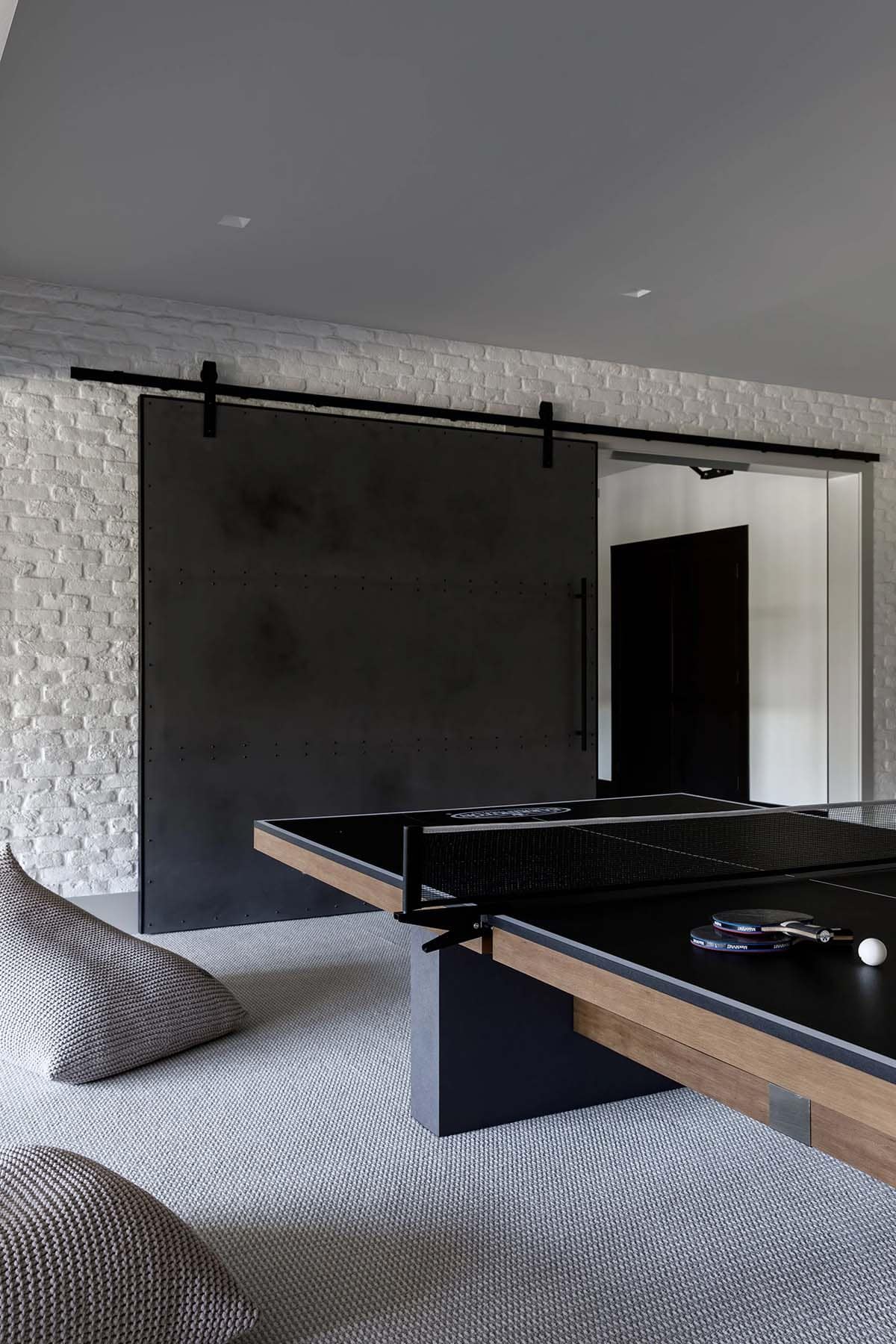 modern pool table and sliding barn door
