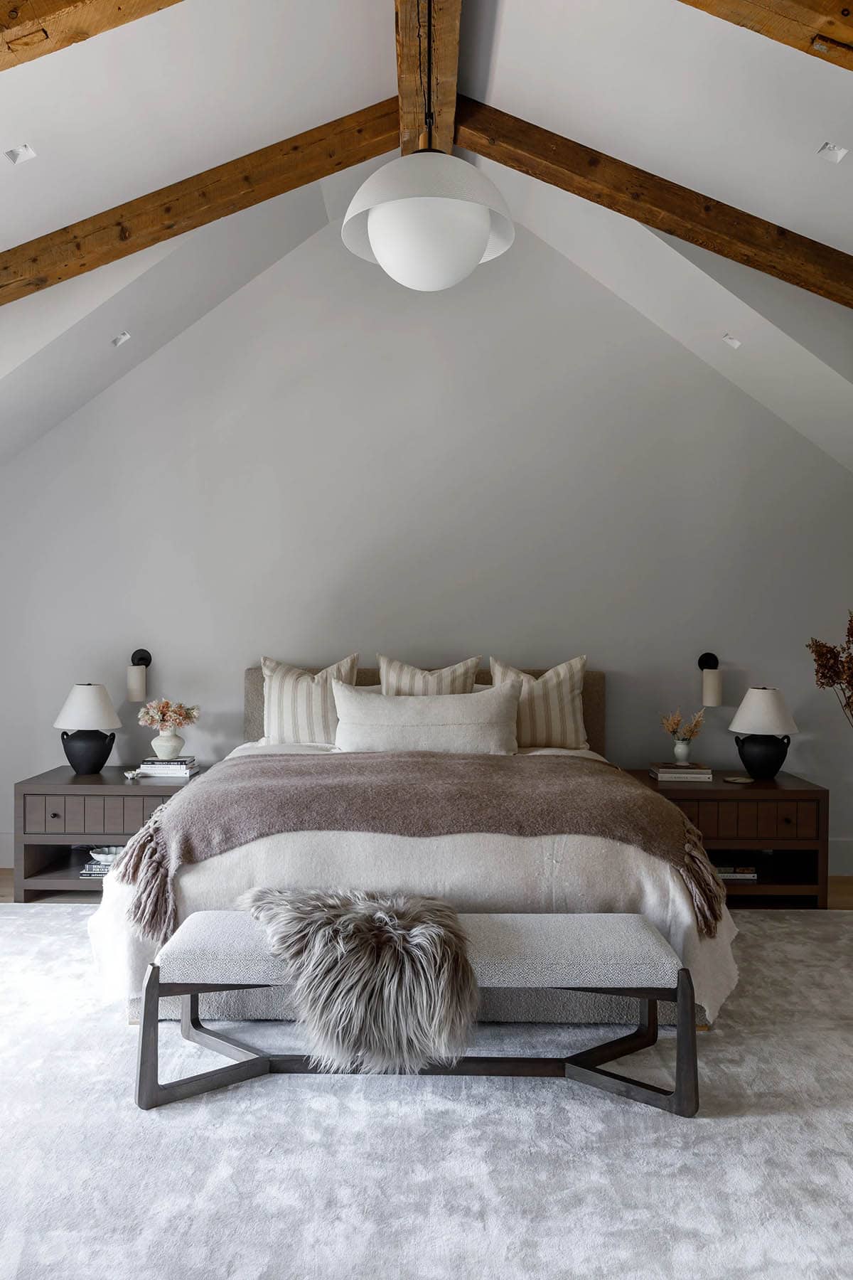 rustic modern bedroom with a vaulted ceiling