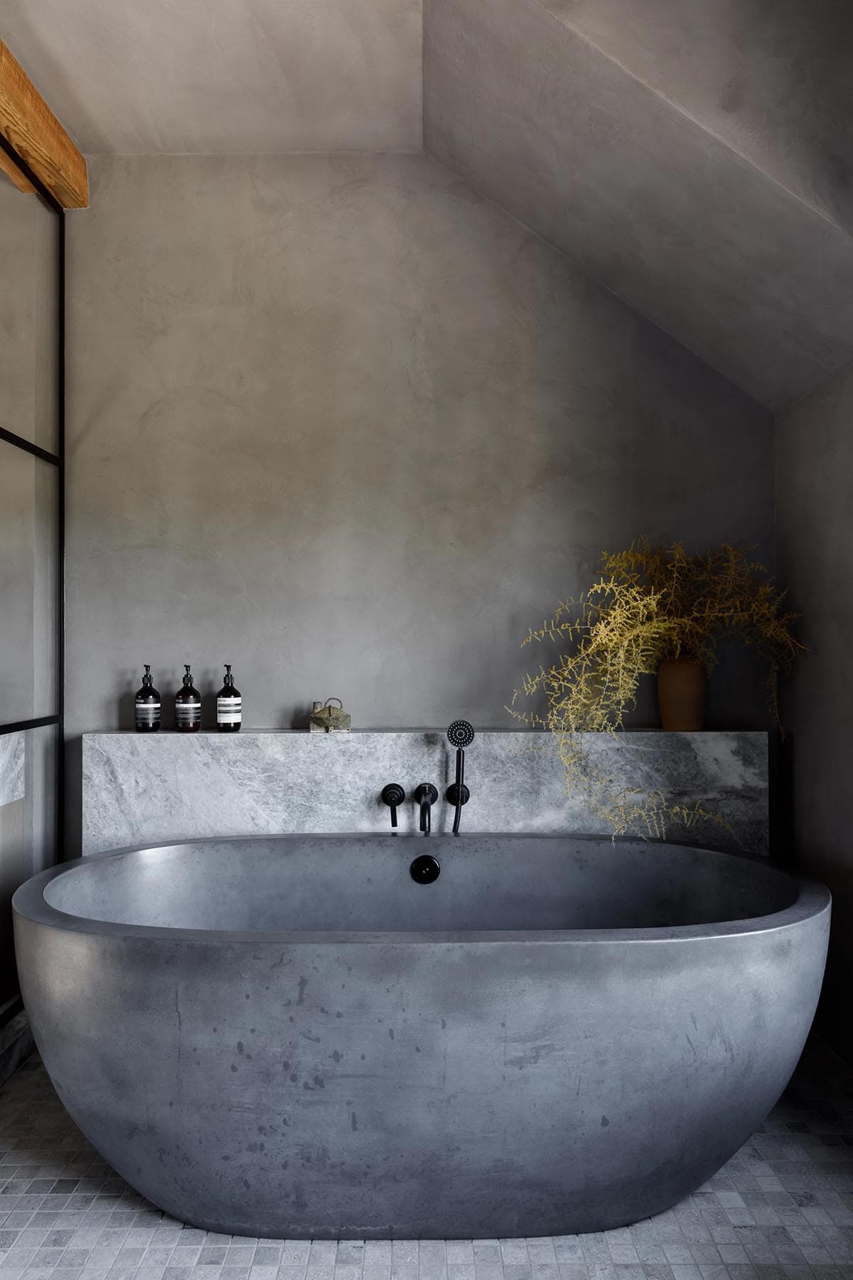 rustic modern bathroom with a freestanding tub