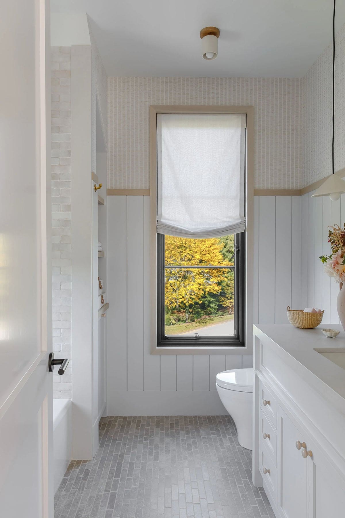 rustic modern bathroom with a large window