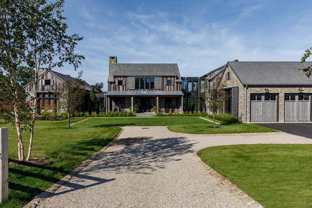 rustic modern barn house exterior with a long driveway