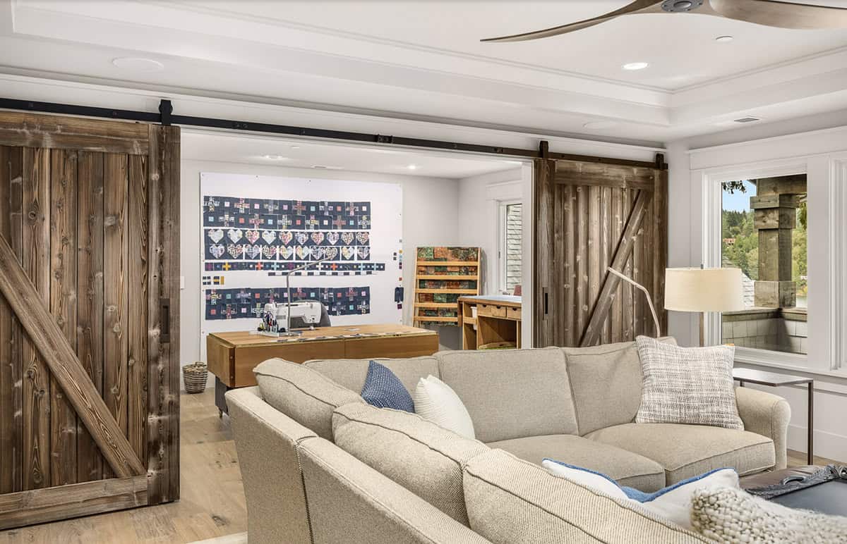Transitional Family Room with sliding barn doors