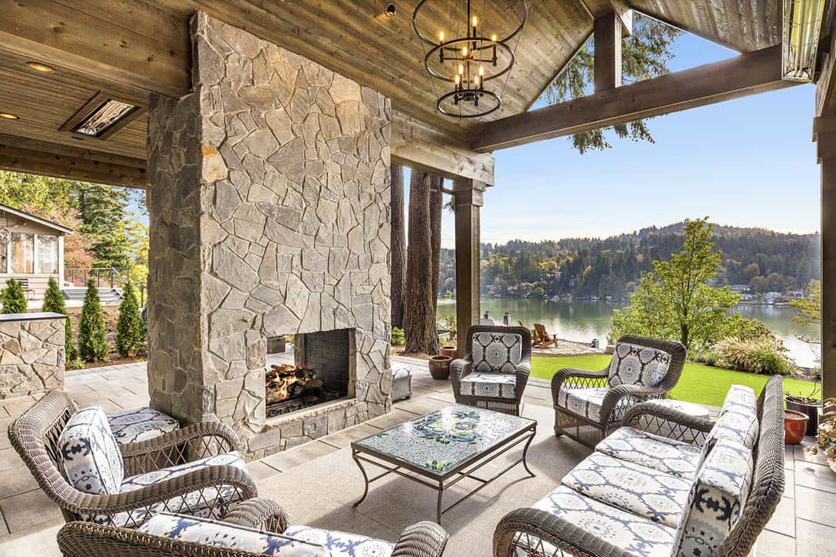 Transitional Covered Patio with a fireplace and outdoor furniture