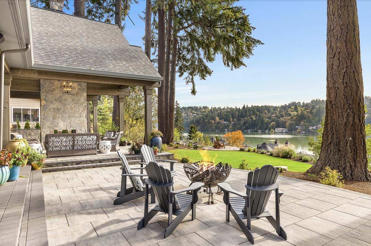 Transitional Lake House patio with a fire pit and adirondack chairs