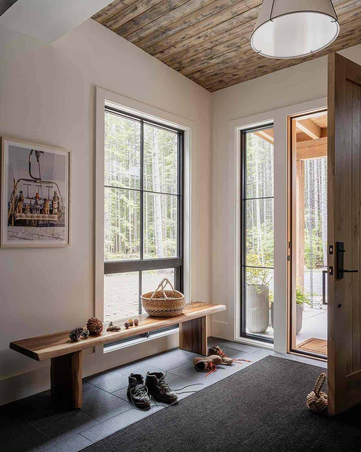 Entryway mudroom with live-edge wood bench, black-framed windows, and tongue-and-groove wood ceiling, Mt. Rainier cabin