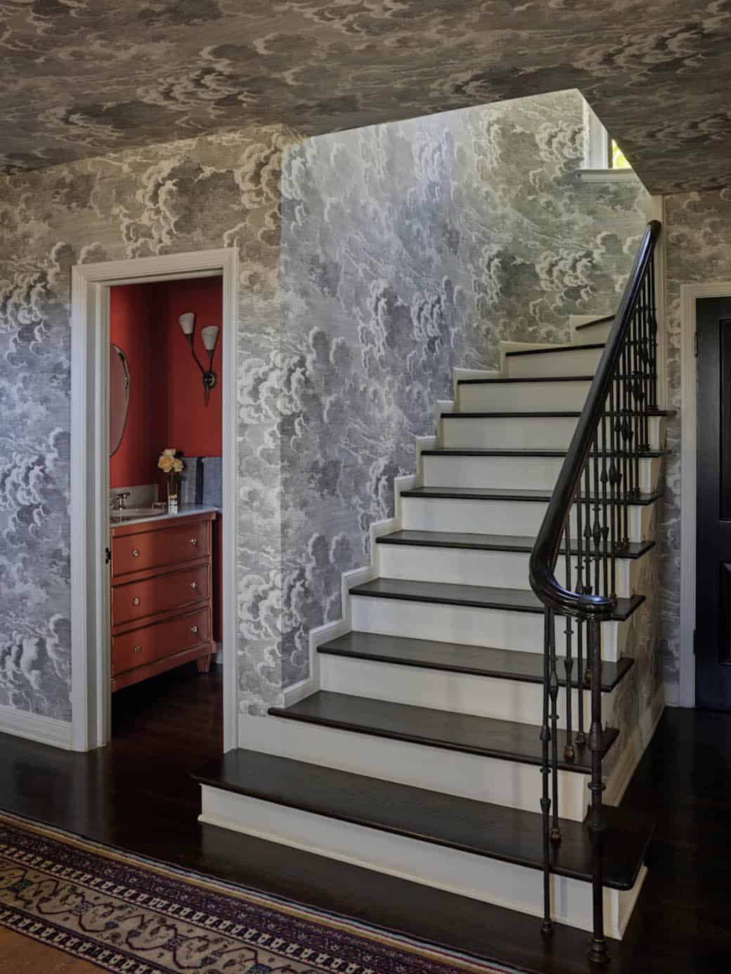 Entry staircase with dramatic cloud wallpaper and powder room, Los Feliz colonial revival home