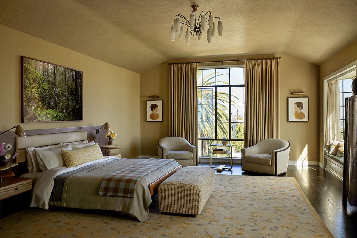 Primary bedroom with grasscloth ceiling, vintage chandelier, upholstered headboard, and palm tree views, Colonial Revival home, Los Feliz