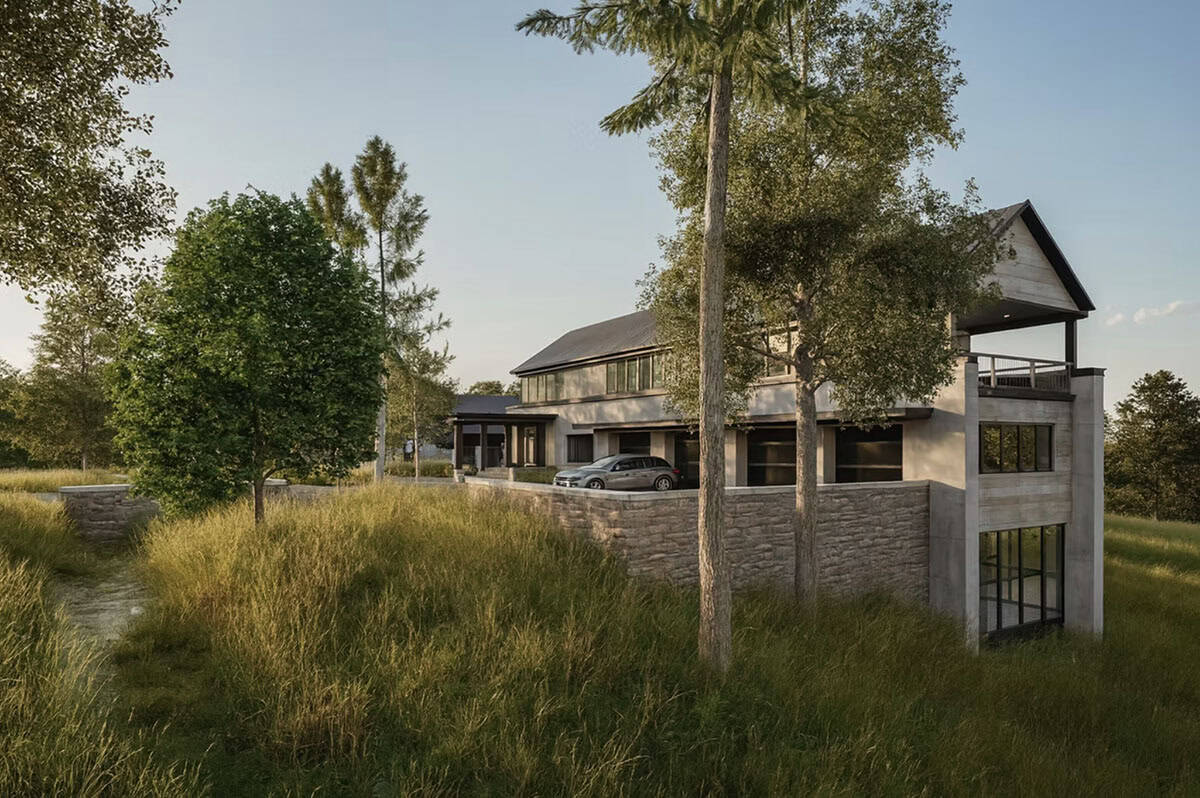 Nature's Edge contemporary home with stone retaining wall and upper deck overlooking natural landscape in Hudson Wisconsin