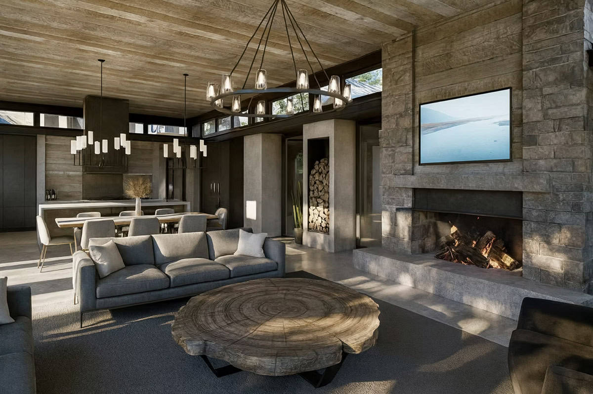 Contemporary living room with stone fireplace, tree slab coffee table, round chandelier, and wood ceiling in Hudson Wisconsin
