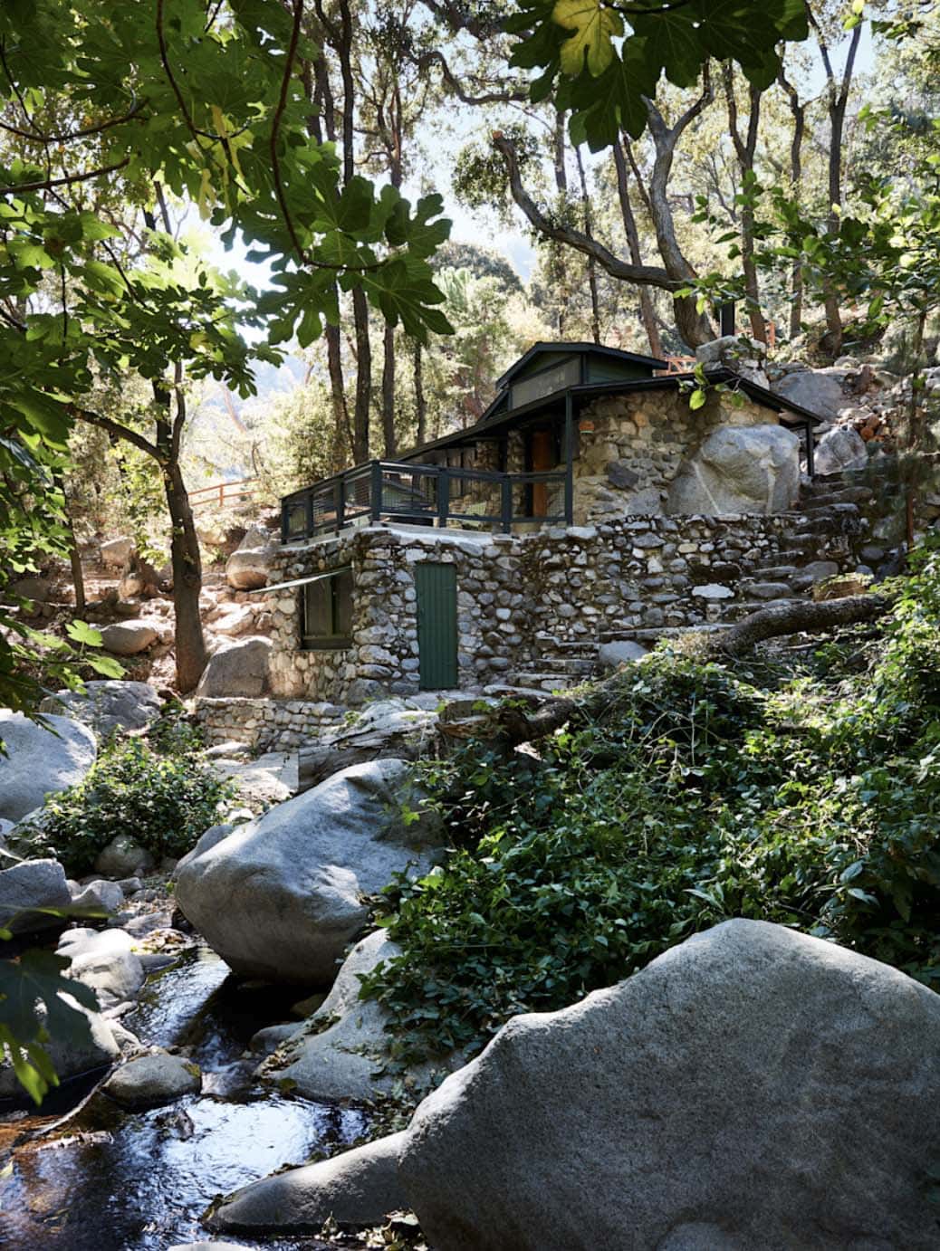 100-year-old stone cabin perched above a boulder-lined stream, San Gabriel Mountains, California