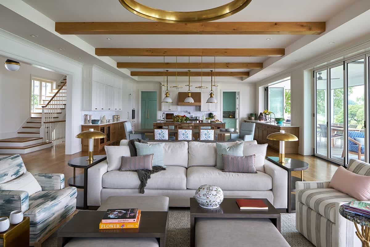 Great room with folding doors opening to waterfront terrace in Eastern Shore Maryland home