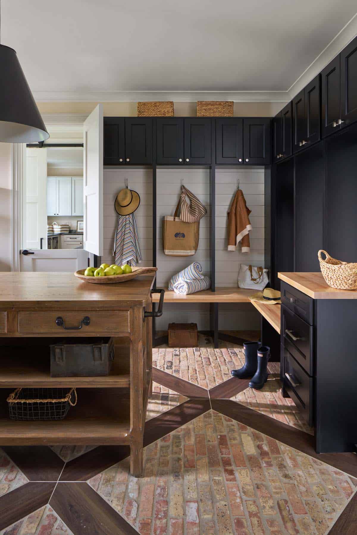 Mudroom with Chicago brick flooring and custom wooden inlay in Maryland Eastern Shore home