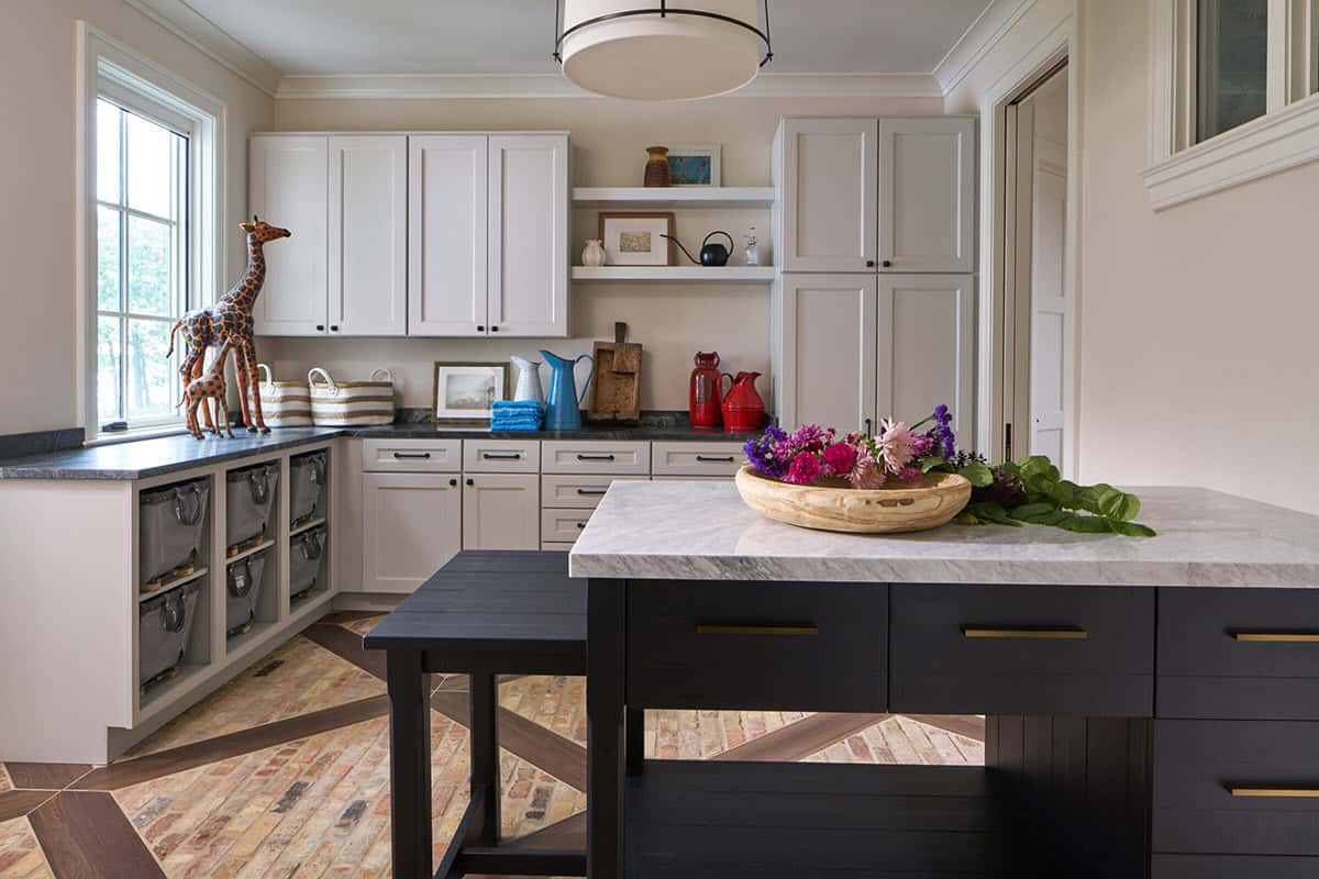 laundry room with a folding table and storage cabinetry