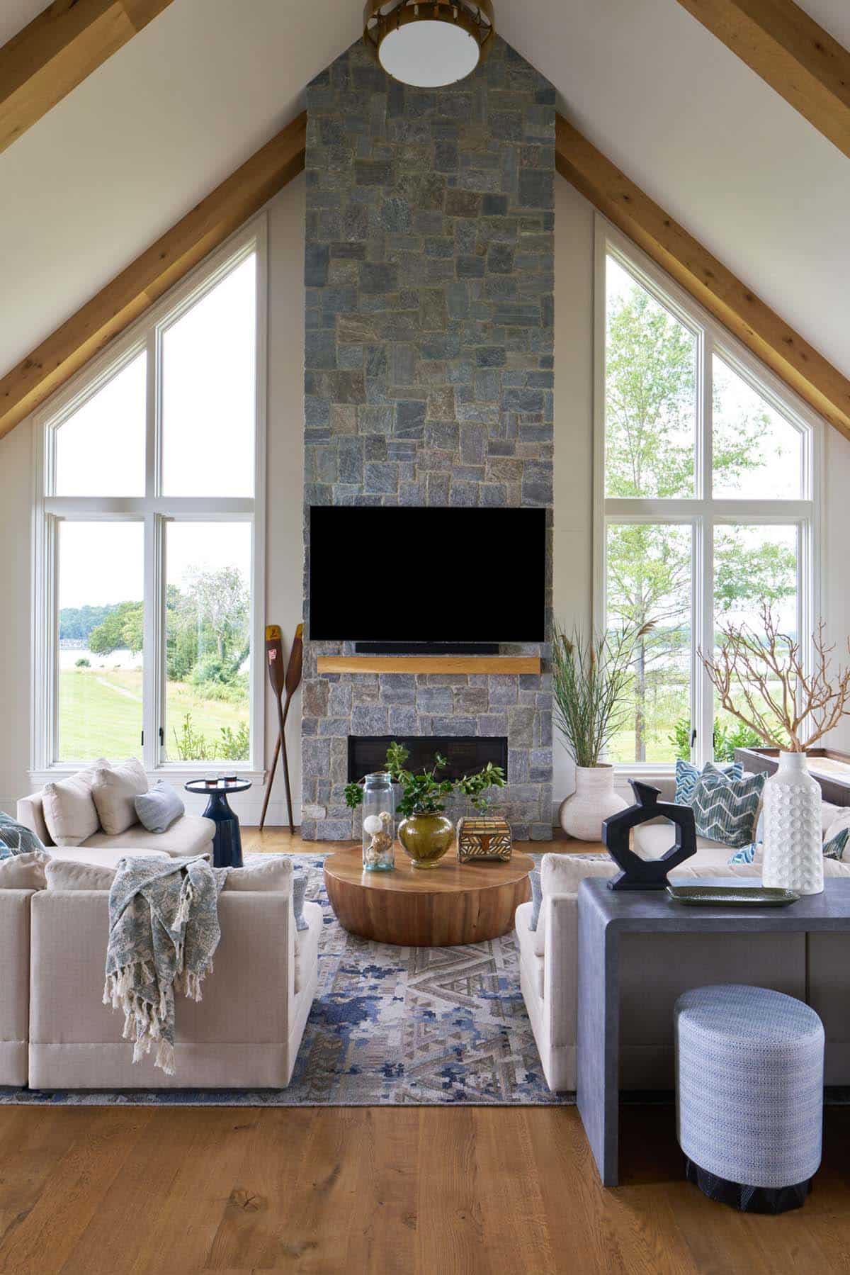 Elegant transitional great room with white oak floors and water views in Maryland farmhouse
