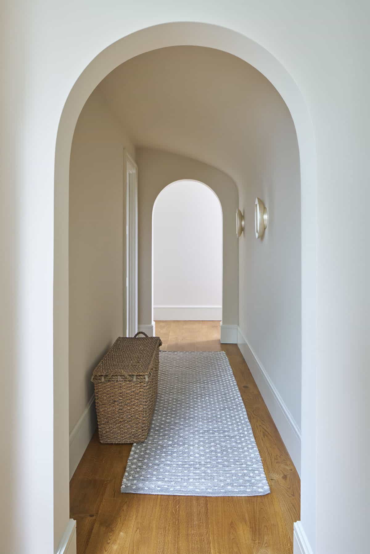 contemporary hallway with white oak floors and a runner