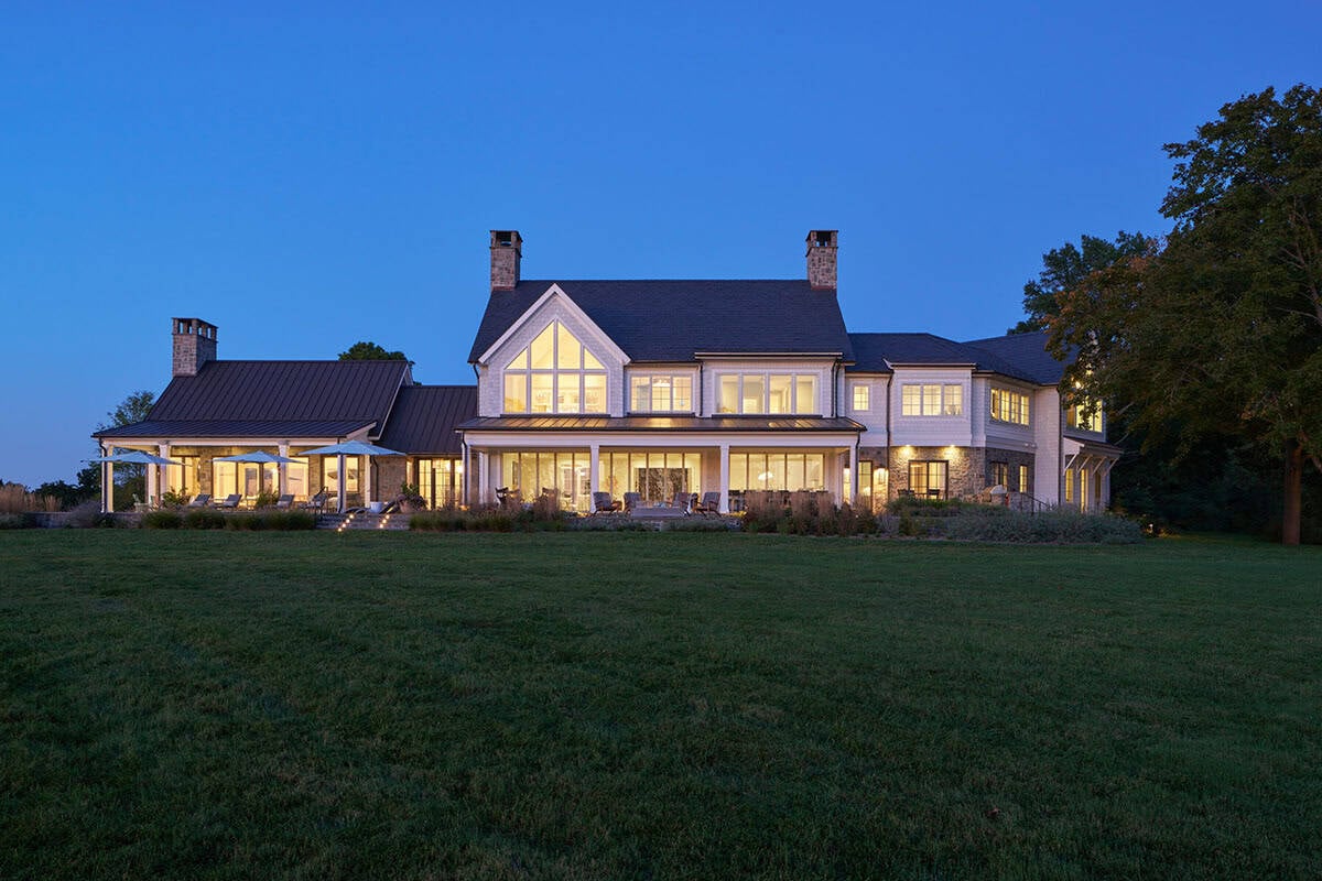 Contemporary rear elevation of Eastern Shore waterfront home at dusk